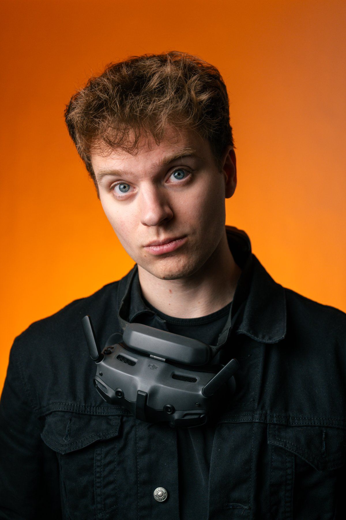 Brennan Hawkins with FPV goggles around his neck